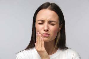Что вызывает боль в челюсти