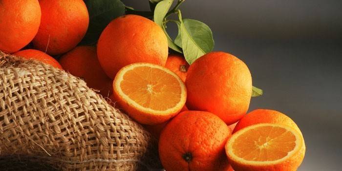 Апельсины целые и половинки
